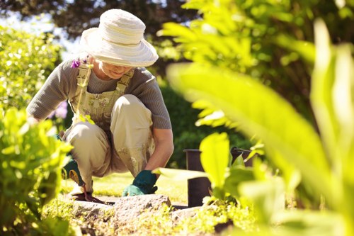 Professional landscaper mowing a lush green lawn